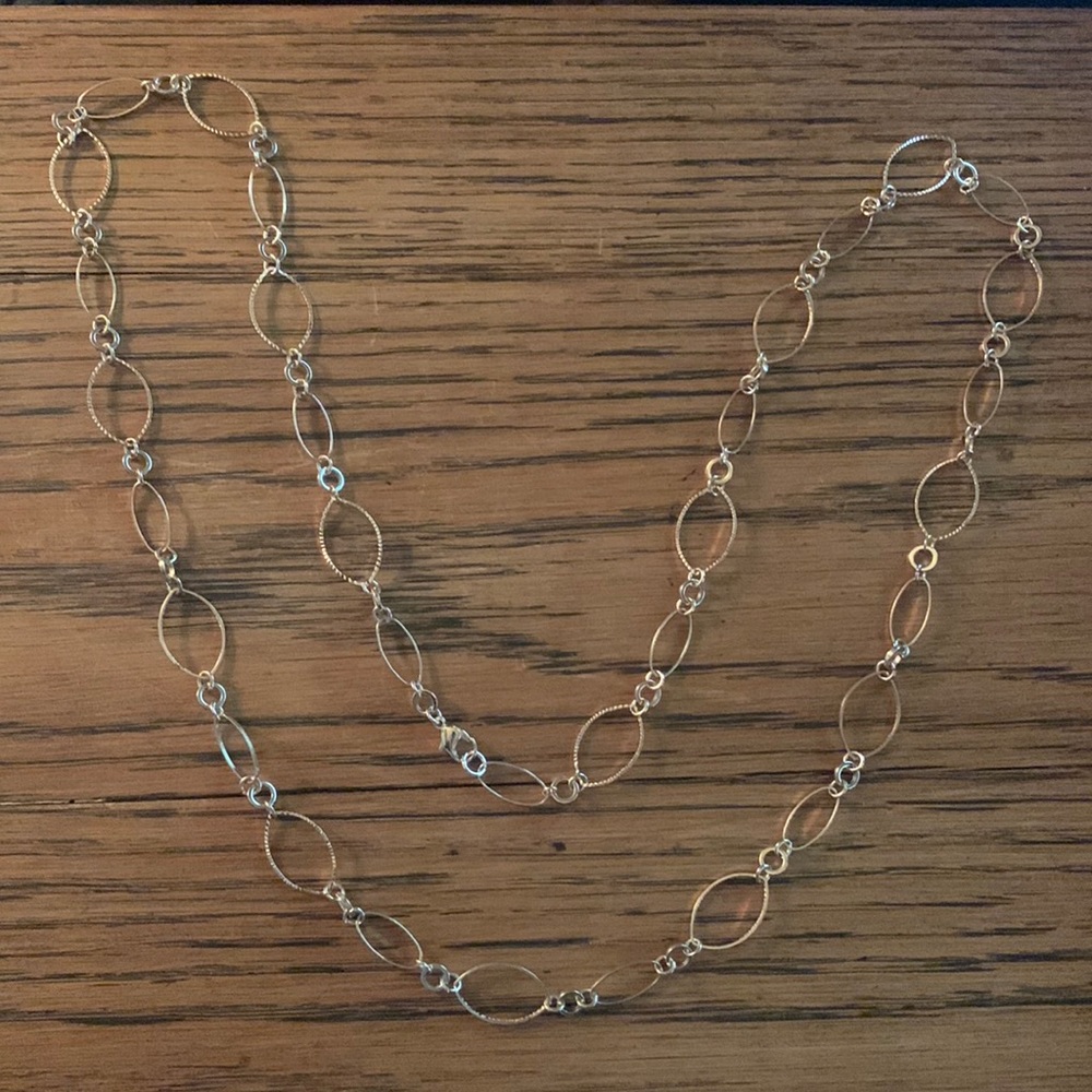 Goldtone women’s long necklace